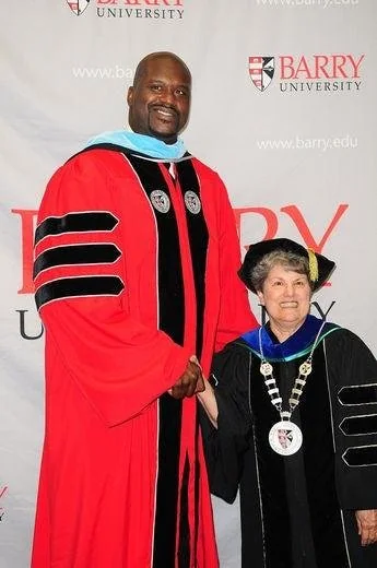 Shaquille O'Neal receiving his Doctor of Education degree at the Barry University graduation ceremony.